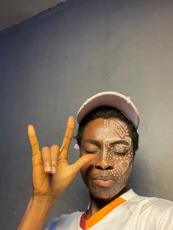 Person with traditional face paint photographed in Nkpor, Nigeria