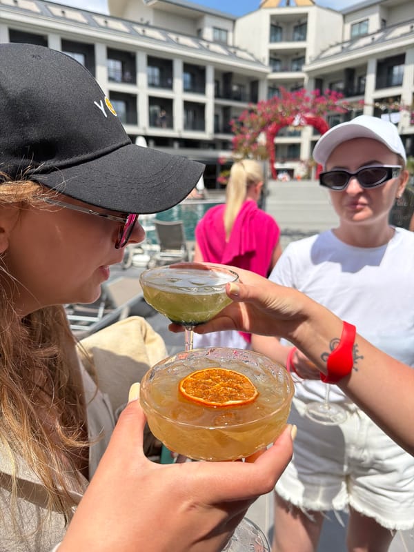 Women toast cocktails at modern Serik hotel lounge