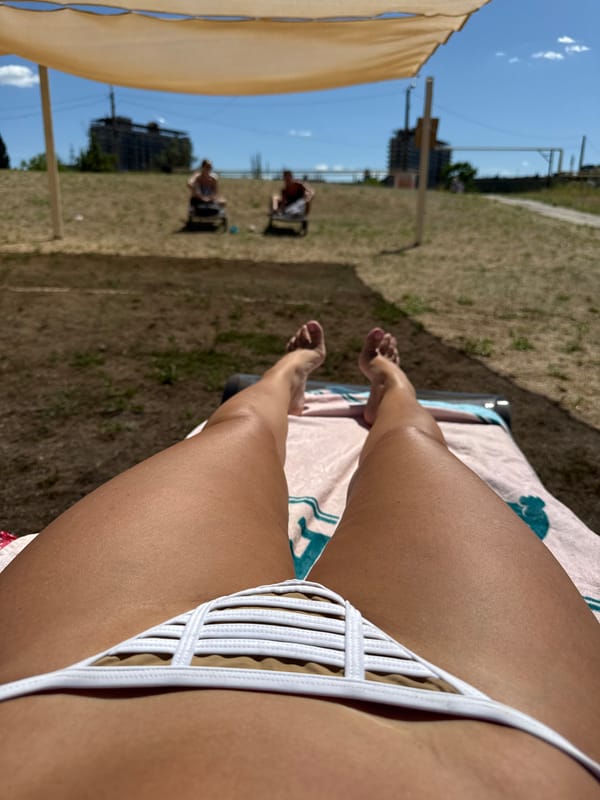 Relaxing on an Odesa beach, snail shell in hand