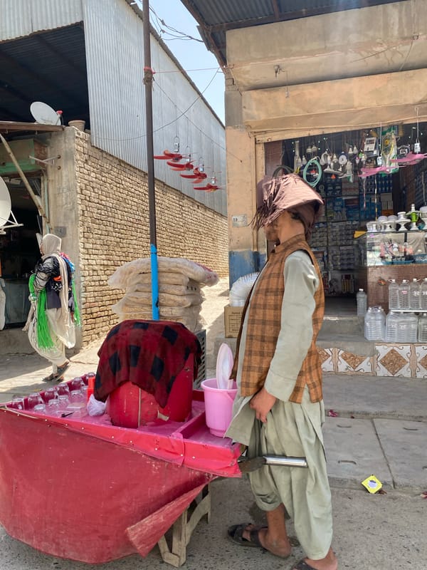 A busy morning along Kandahar's commercial streets and market stalls.