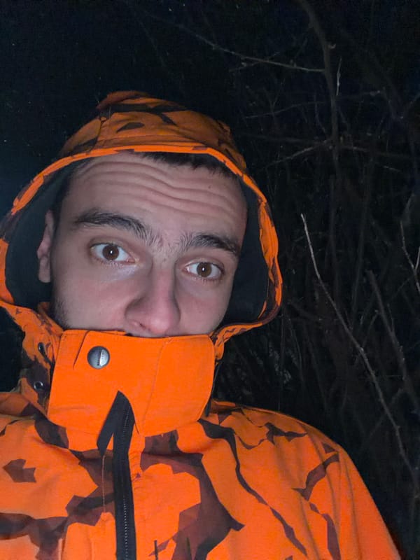 Man in orange camouflage jacket photographed outdoors in Slivnitsa