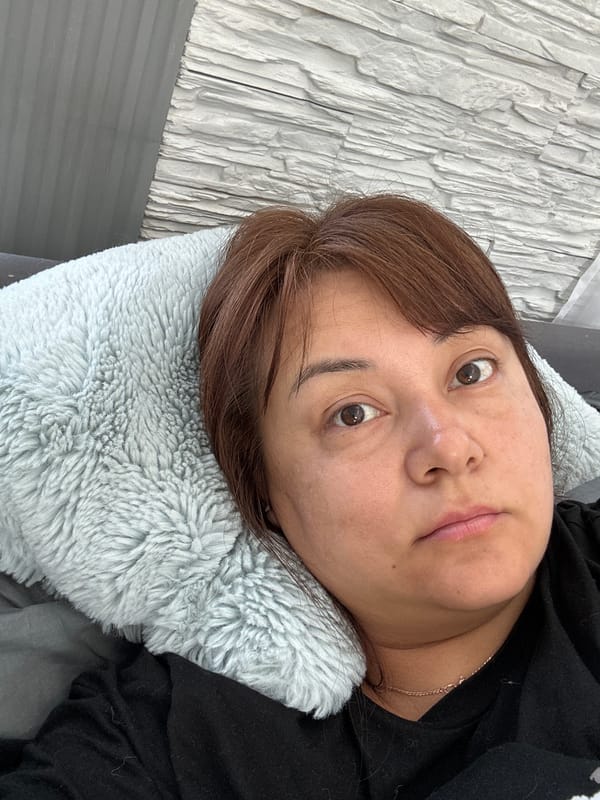 Woman resting in bedroom during early morning hours