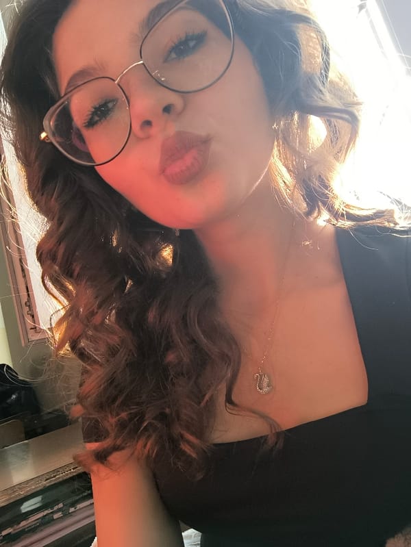 Young women photograph selfies in Pernik classrooms during morning hours