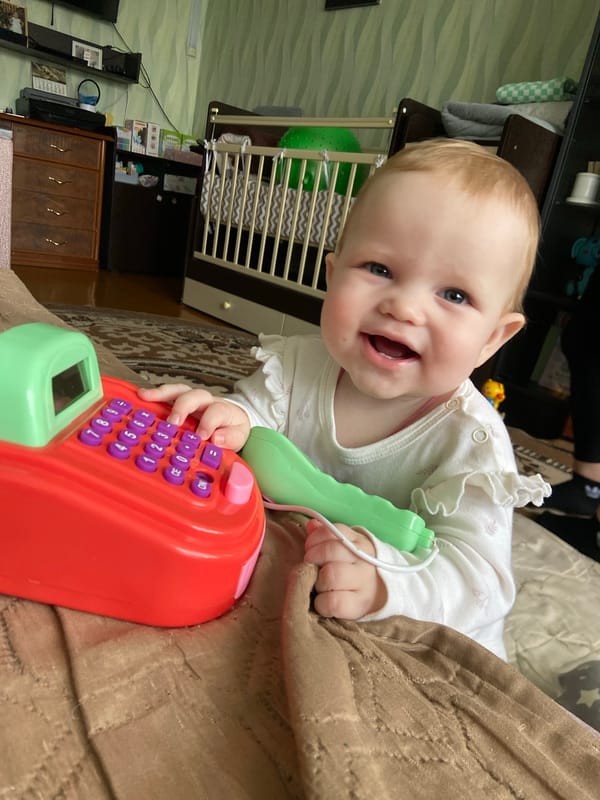 Father and baby share playful moments in Russian home