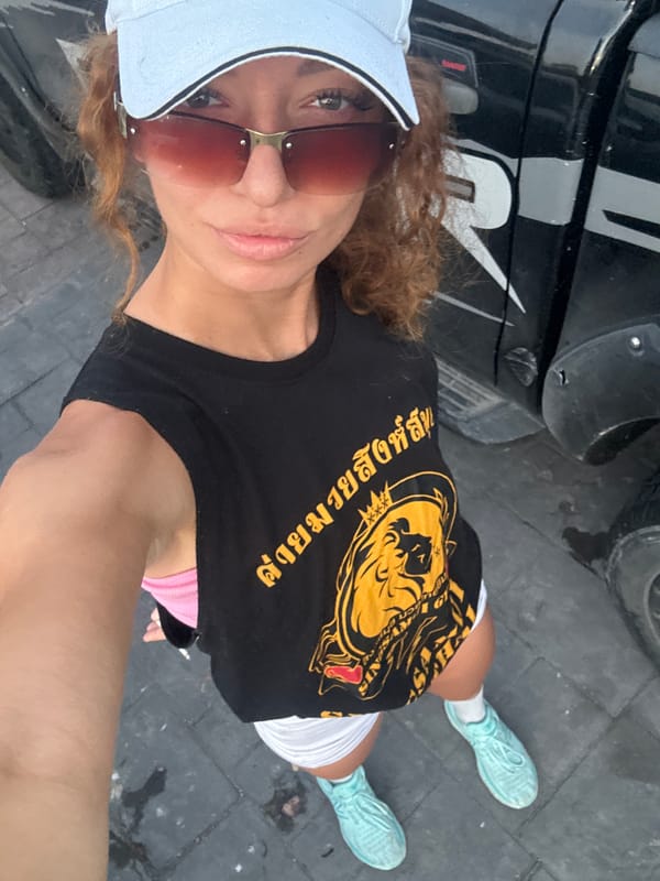 Woman takes nighttime selfie on Baan Chaweng sidewalk