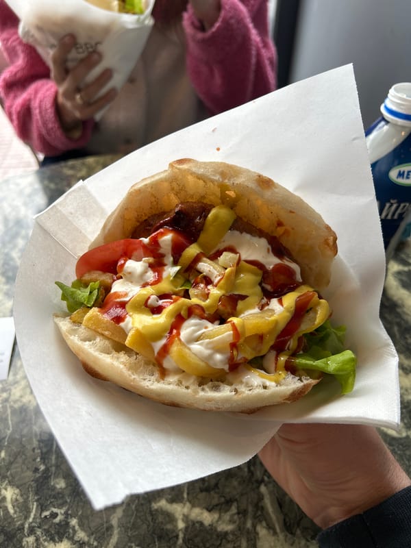 Couple enjoys outdoor meal in Plovdiv on overcast afternoon