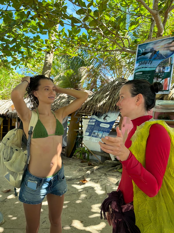 Two women photographed at beach in General Luna, Philippines