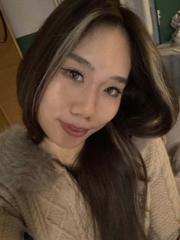 Woman takes multiple portraits and selfies indoors in China