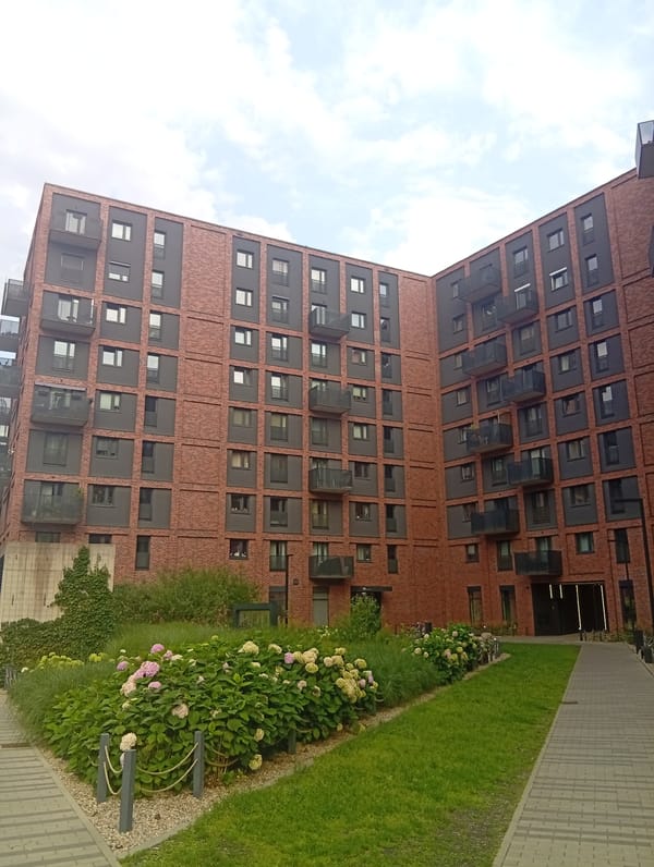 Inside Wrocław's Portowice residential complex, late afternoon