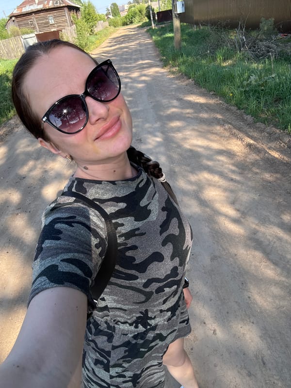 Woman in camouflage spotted on rural paths in Rusalevka