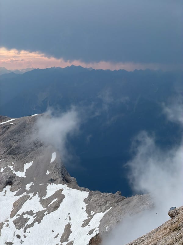 Rocky alpine peaks and hazy ridgelines above Grainau