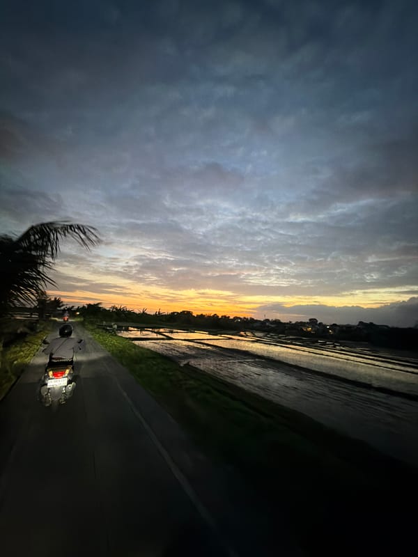 Sunset motorcycle ride and barbershop visit documented in North Kuta