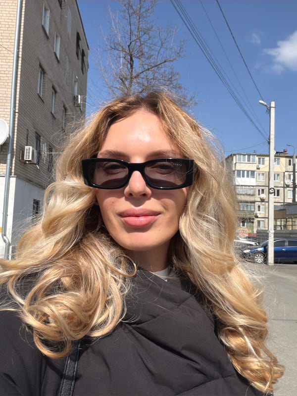 Woman poses for photos on Dnipro street
