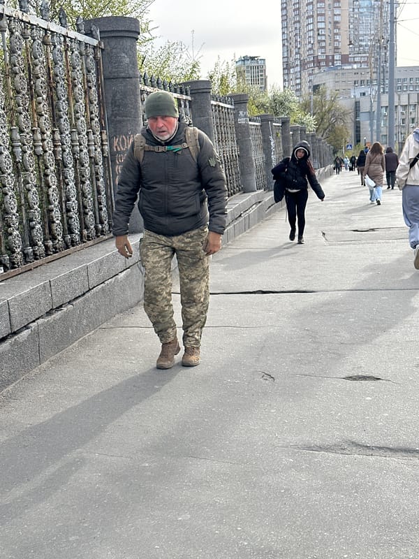 Morning street life documented across Kyiv during overcast day