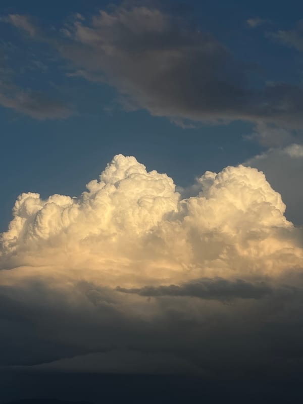 Dramatic cumulus clouds at golden hour over Gabrovo, Bulgaria.