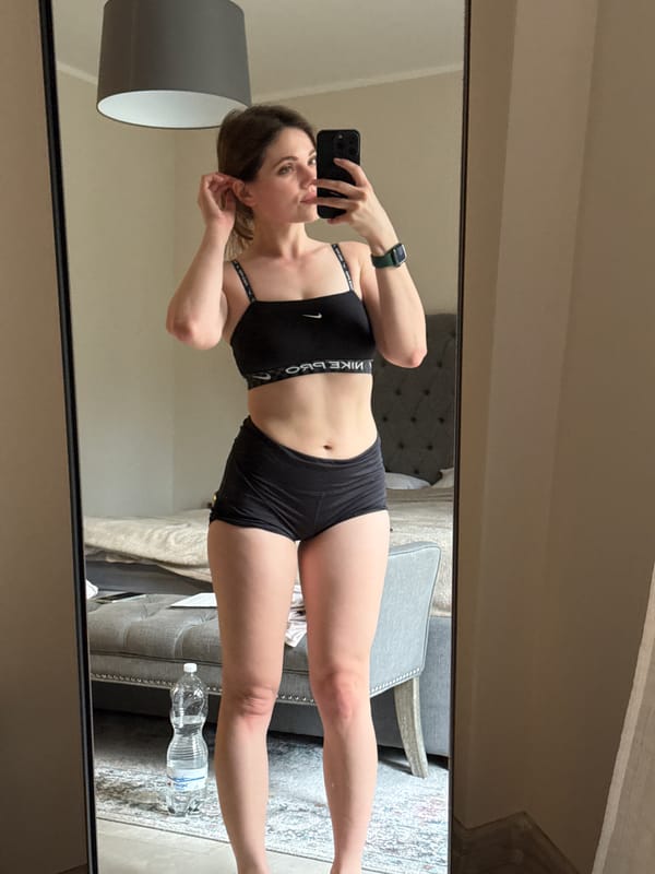 Woman takes mirror selfies in athletic wear in Karlovy Vary