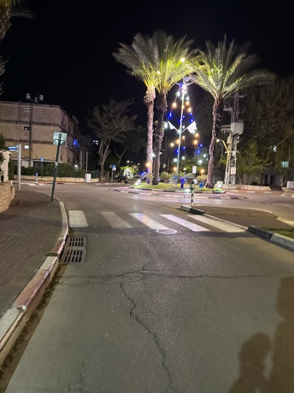 Decorated street scene observed in Kiryat Bialik after dusk