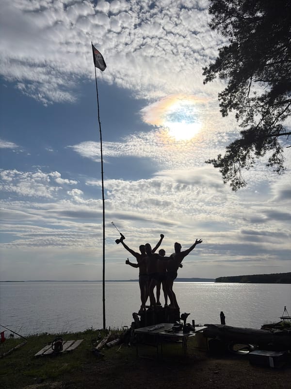 Lakeside gathering observed under solar halo in Забегаево, Russia