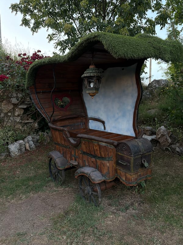 Fairytale village with hobbit houses and floating pond structures