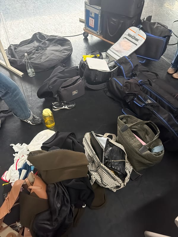 Film crew sets up equipment backstage in London studio