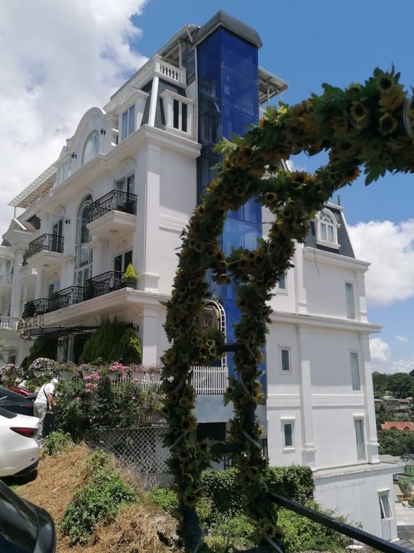Da Lat hotels, hillside buildings, and city views on a summer morning