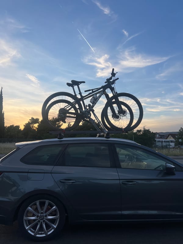 Car with roof-mounted bikes spotted during sunset in Podgorica