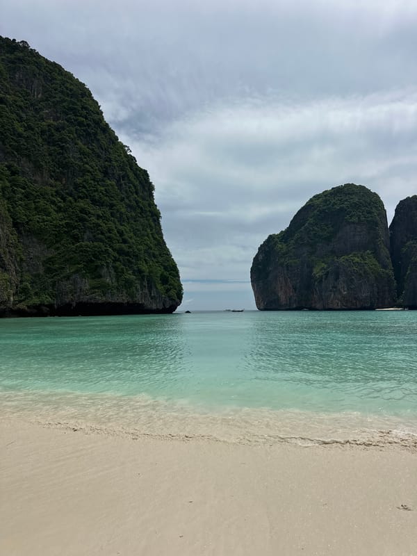 Dawn tourists explore Maya Bay's beaches amid limestone cliffs
