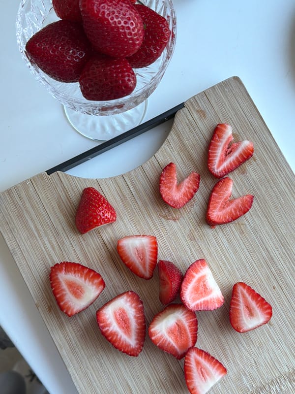 Person photographs playful moments with black cat in Dreiliņi