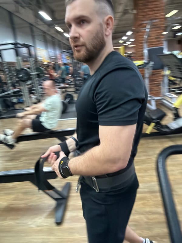 Man performs weighted workout routine at Russian gym
