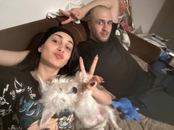 Couple takes selfies with pet dog in Plovdiv apartment