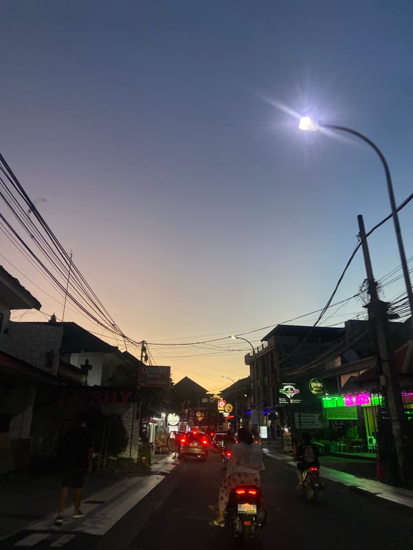 Evening street life documented in Kuta commercial district