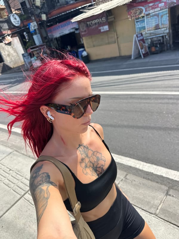 Red-haired woman photographed multiple times on North Kuta streets