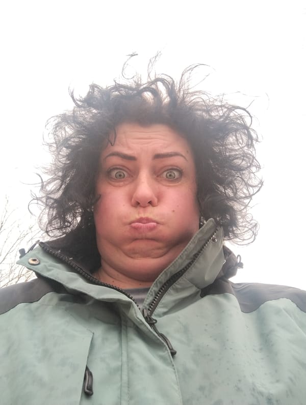 Woman photographed outdoors in wet jacket in Grishanki, Russia