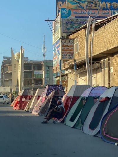 Daily street commerce and traffic scenes captured in Kandahar