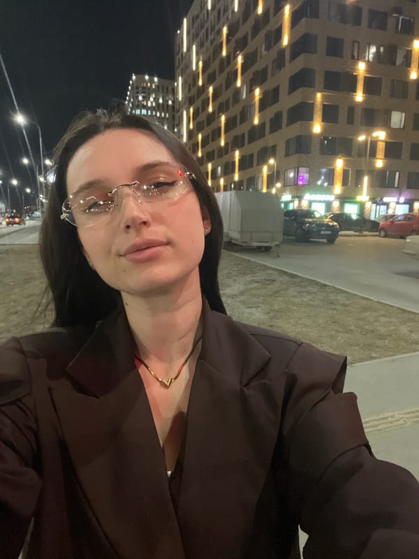 Woman documents evening street walk with selfies in Tyumen