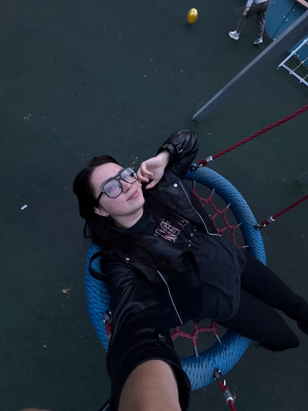 Playground swing session with woman, child, and husky dog captured