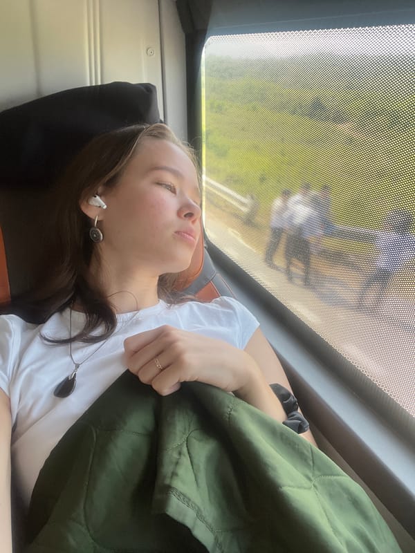Woman rests on transport vehicle near Khánh Vĩnh, Vietnam