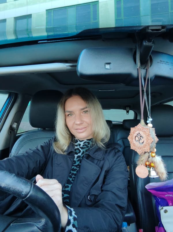 Woman applies makeup, takes selfies in car in Kamchatka