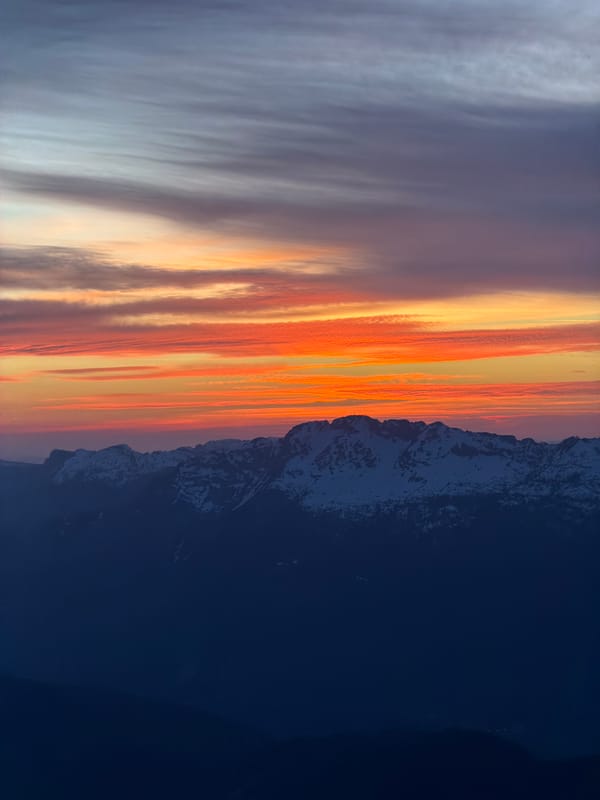 Vibrant sunset captured over snow-covered Alps in La Giettaz