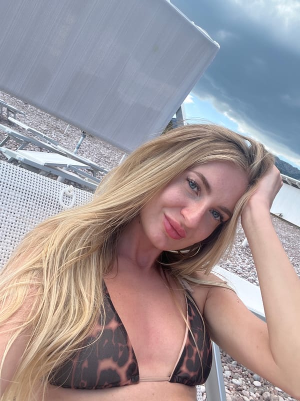 Blonde women take beach selfies at Sveti Stefan resort
