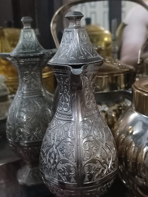 Traditional decorative wares and ornate metalwork on display in Blang Cut