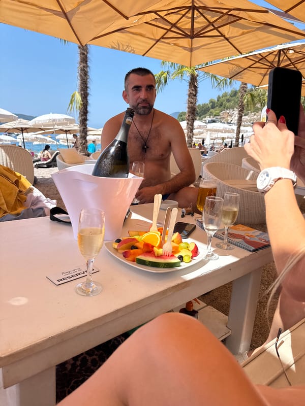 Champagne and selfies at a sunny beach club