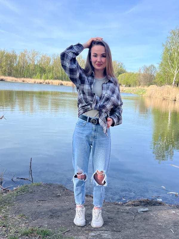 Young people gather for outdoor activities near water in Ciemne