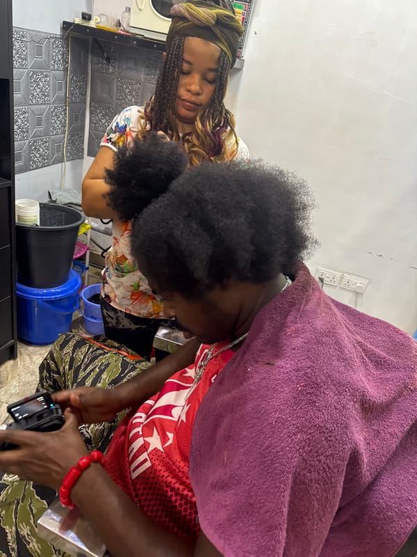 Evening hair salon activity documented at Citytrims Enterprise, Dome Ghana