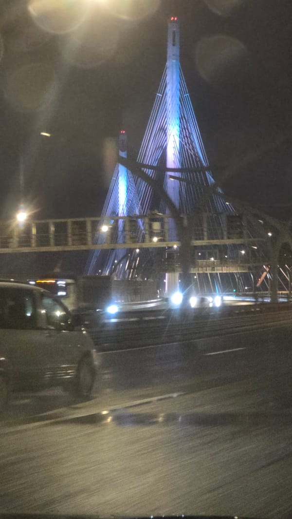 Blue-lit Saint Petersburg bridge captured in nighttime vehicle footage