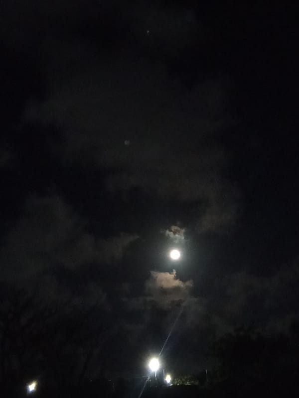 Full moon observed through clouds in Juan Griego, Venezuela