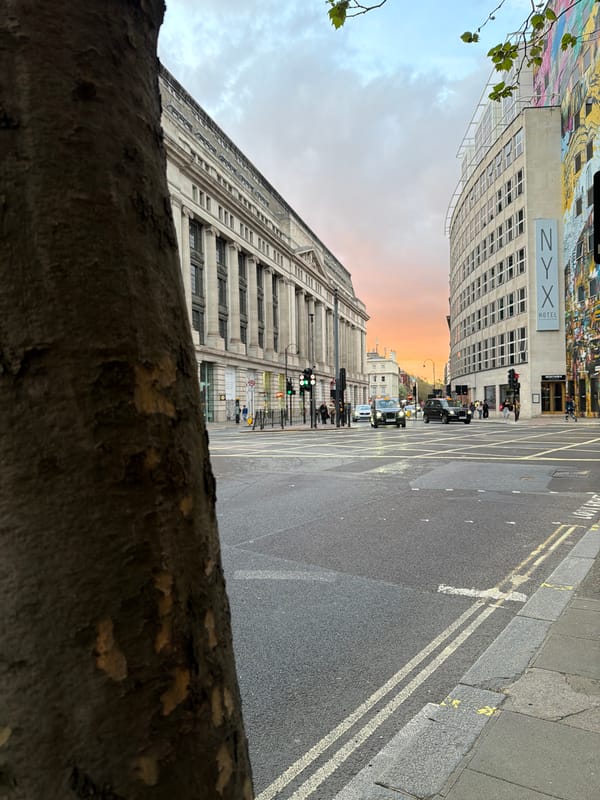 Masked man rides decorated tricycle with passengers through London