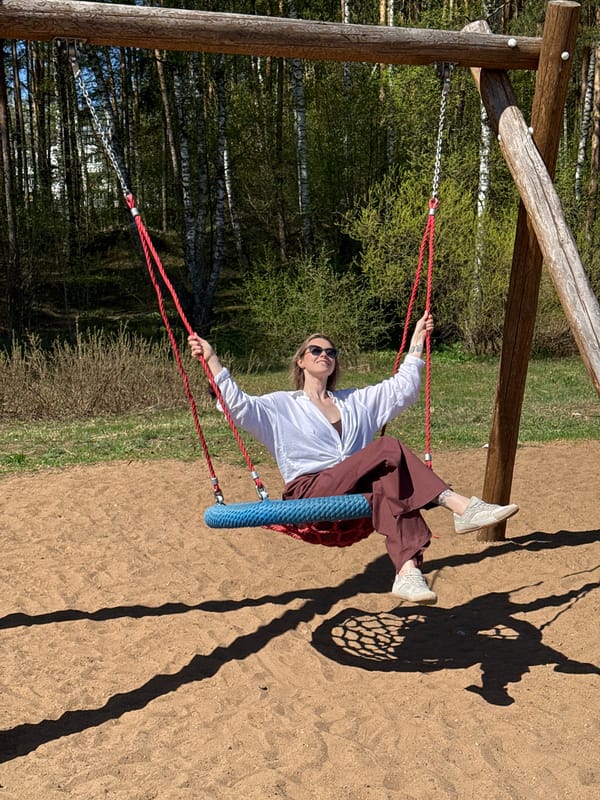 Woman enjoys tire swing at Chaikovsky recreation area