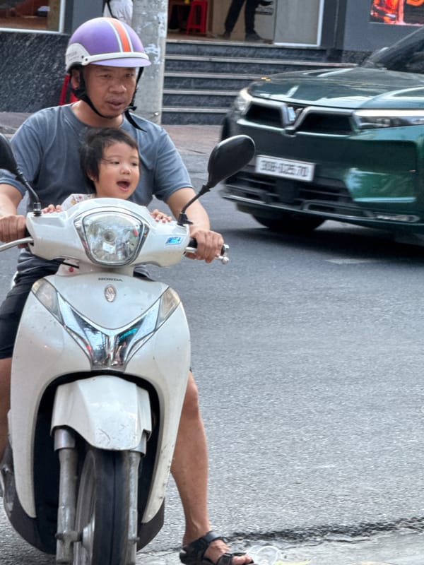 Nha Trang street life: scooters, pedestrians, and city rhythm