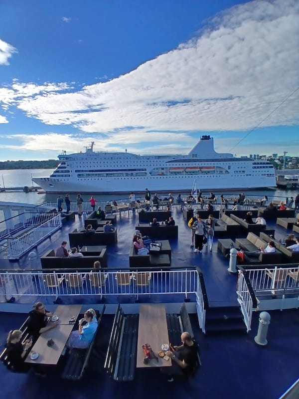 Ferry deck life in Tallinn harbor on a calm summer morning